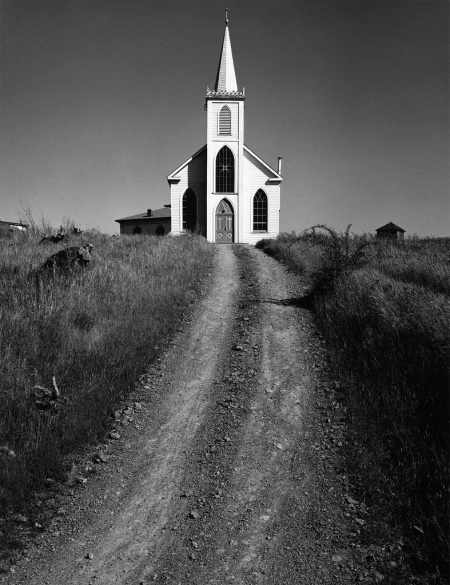 Ansel Adams, Church and Road, Bodega, California (1953) [http://theonlinephotographer.typepad.com/the_online_photographer/2012/01/ansel-adams-at-the-lake-county-discovery-museum.html]